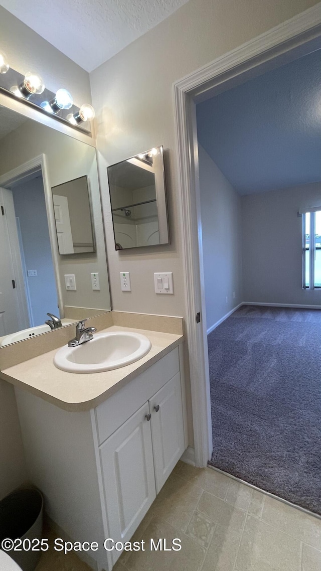975 Luminary Cir Unit 103, Melbourne, FL 32901 - bathroom featuring vanity and a textured ceiling