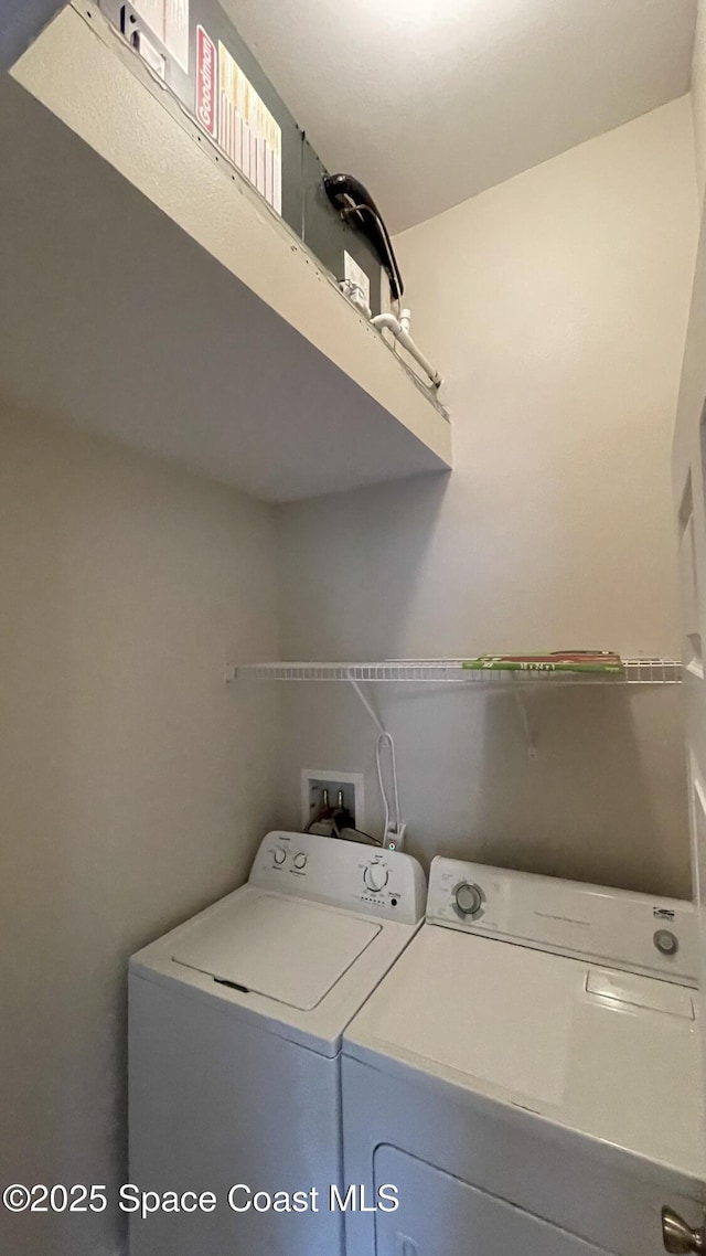 975 Luminary Cir Unit 103, Melbourne, FL 32901 - washroom featuring washing machine and clothes dryer