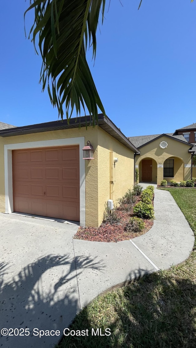 975 Luminary Cir Unit 103, Melbourne, FL 32901 - view of home's exterior featuring stucco siding