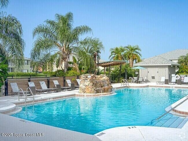 975 Luminary Cir Unit 103, Melbourne, FL 32901 - community pool with a patio