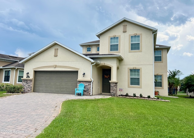 2810 Amethyst Way, Melbourne, FL 32940 - view of front of home featuring stucco siding, decorative driveway, a front yard, an attached garage, and stone siding