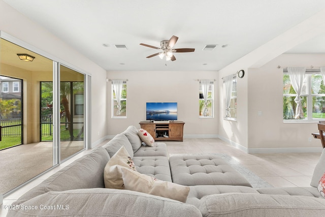 2810 Amethyst Way, Melbourne, FL 32940 - living area featuring plenty of natural light, a ceiling fan, and light tile patterned floors