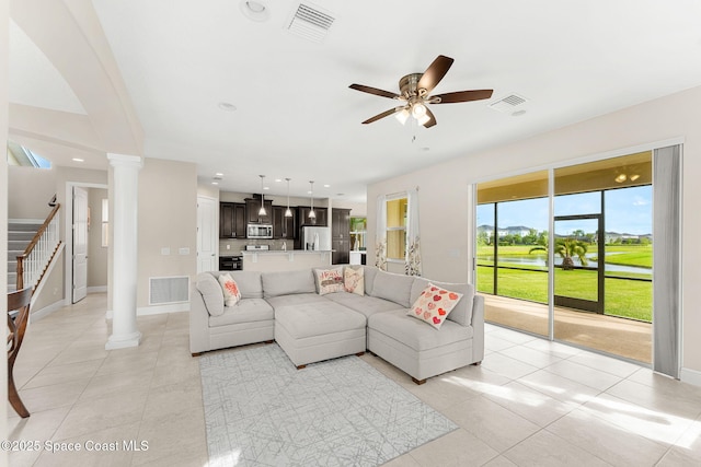 2810 Amethyst Way, Melbourne, FL 32940 - living room with decorative columns, a ceiling fan, and light tile patterned flooring