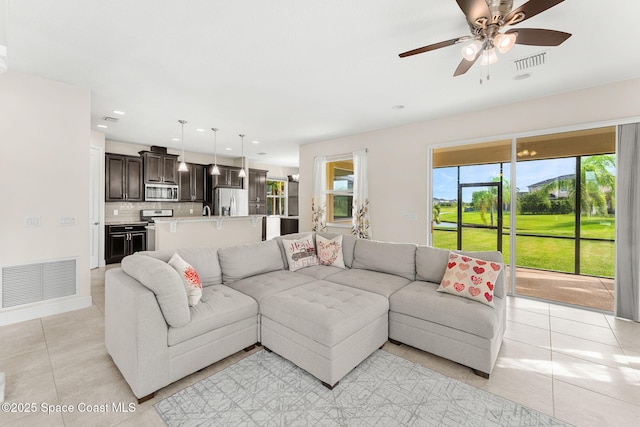 2810 Amethyst Way, Melbourne, FL 32940 - living room with light tile patterned floors, healthy amount of natural light, ceiling fan, and recessed lighting