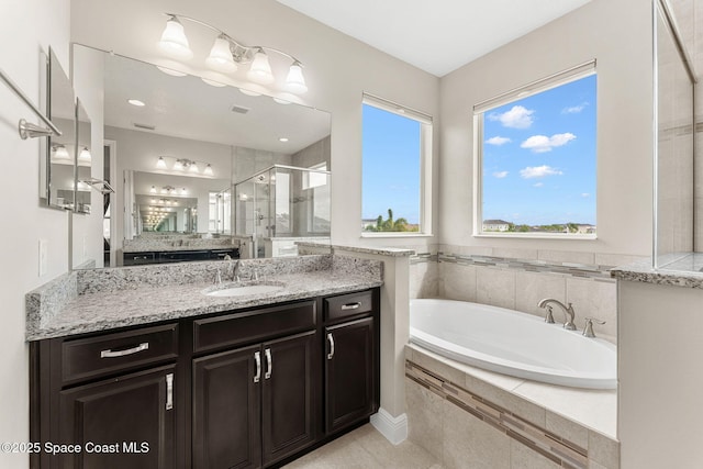 2810 Amethyst Way, Melbourne, FL 32940 - full bathroom featuring a shower stall, vanity, a garden tub, and tile patterned floors