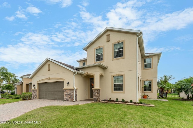 2810 Amethyst Way, Melbourne, FL 32940 - view of front of house featuring stucco siding, decorative driveway, a front yard, an attached garage, and stone siding