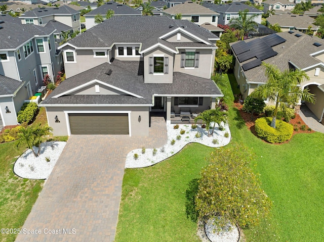 8212 Paragrass Ave, Melbourne, FL 32940 - view of front of home featuring a residential view, stucco siding, roof with shingles, and a garage