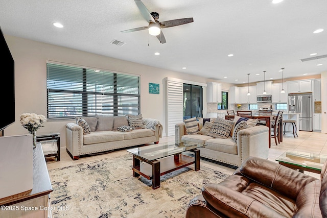 8212 Paragrass Ave, Melbourne, FL 32940 - living area with ceiling fan and recessed lighting