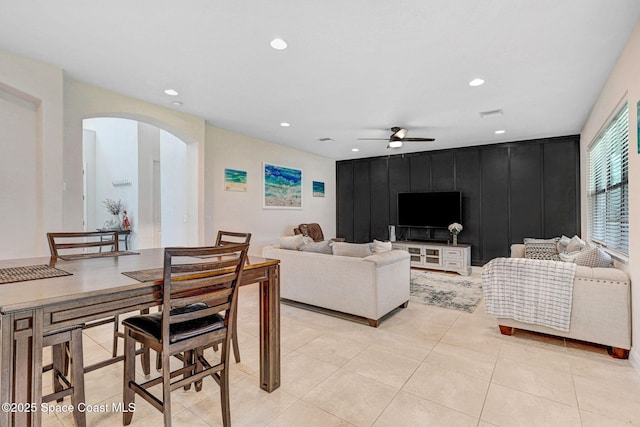 8212 Paragrass Ave, Melbourne, FL 32940 - living room with arched walkways, a ceiling fan, recessed lighting, and light tile patterned floors