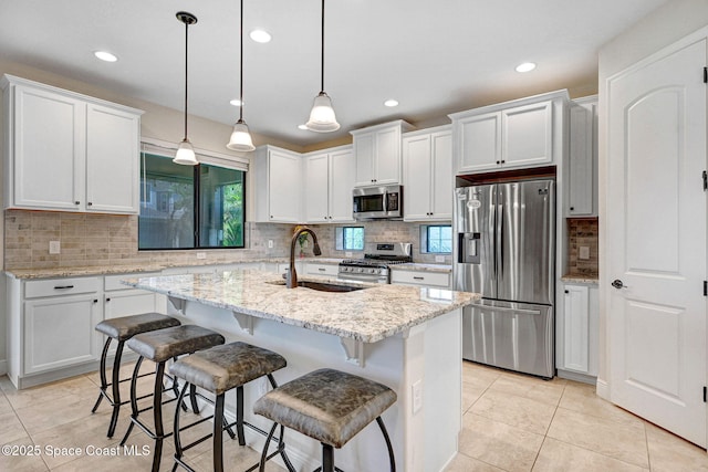 8212 Paragrass Ave, Melbourne, FL 32940 - kitchen with stainless steel appliances, a sink, decorative backsplash, white cabinets, and recessed lighting