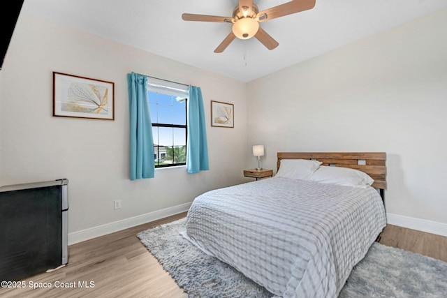 8212 Paragrass Ave, Melbourne, FL 32940 - bedroom featuring wood finished floors, baseboards, and ceiling fan