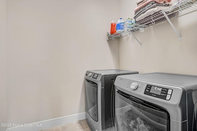 8212 Paragrass Ave, Melbourne, FL 32940 - laundry area featuring independent washer and dryer and baseboards