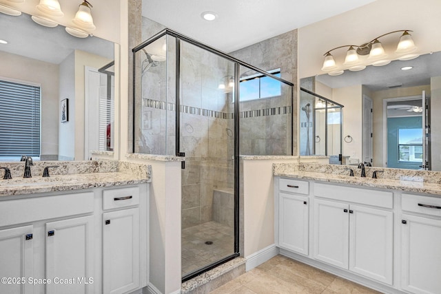 8212 Paragrass Ave, Melbourne, FL 32940 - full bathroom featuring two vanities, a stall shower, healthy amount of natural light, tile patterned floors, and recessed lighting