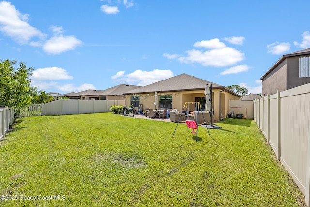 637 Old Country Rd SE, Palm Bay, FL 32909 - back of house with stucco siding, a patio area, and an outdoor hangout area