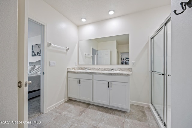 637 Old Country Rd SE, Palm Bay, FL 32909 - full bath with double vanity, ensuite bath, baseboards, and a stall shower