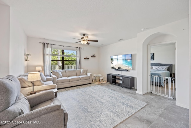 637 Old Country Rd SE, Palm Bay, FL 32909 - living room featuring a ceiling fan and baseboards