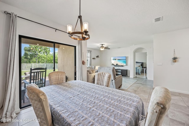 637 Old Country Rd SE, Palm Bay, FL 32909 - dining space with a chandelier, arched walkways, a ceiling fan, baseboards, and a textured ceiling