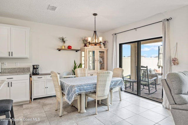 637 Old Country Rd SE, Palm Bay, FL 32909 - dining area with a chandelier