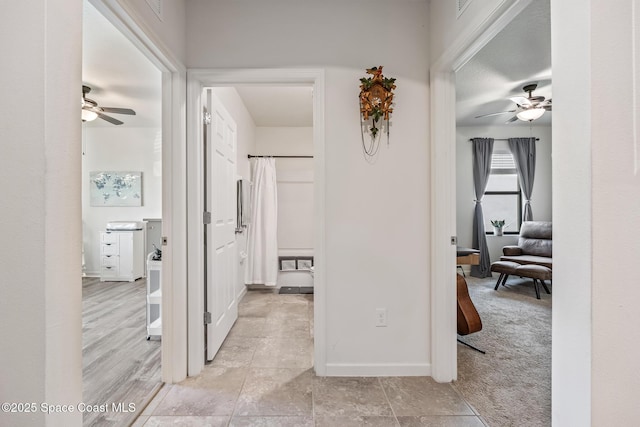 637 Old Country Rd SE, Palm Bay, FL 32909 - corridor with baseboards and light tile patterned floors