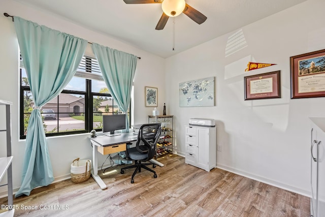 637 Old Country Rd SE, Palm Bay, FL 32909 - office area with wood finished floors, ceiling fan, and baseboards