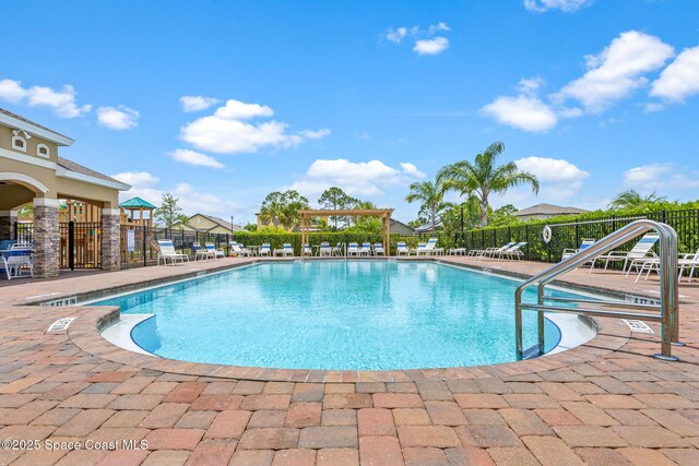 637 Old Country Rd SE, Palm Bay, FL 32909 - community pool featuring a patio area