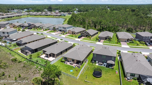 637 Old Country Rd SE, Palm Bay, FL 32909 - aerial perspective of suburban area featuring a large body of water and a heavily wooded area