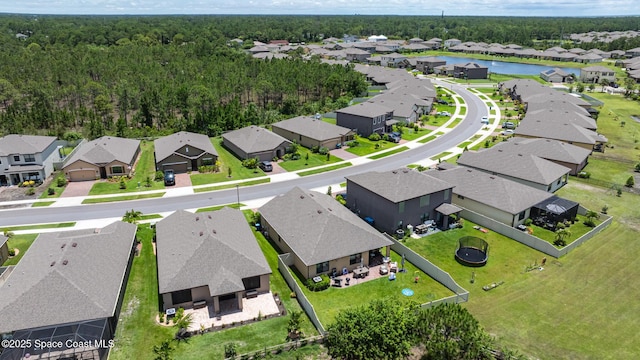 637 Old Country Rd SE, Palm Bay, FL 32909 - aerial perspective of suburban area featuring a large body of water and a heavily wooded area