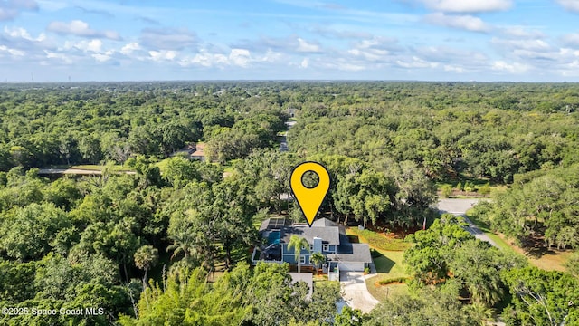 3203 Wind Song Ct, Melbourne, FL 32934 - view from above of property with a forest