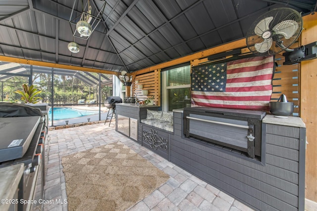 3203 Wind Song Ct, Melbourne, FL 32934 - view of patio / terrace with ceiling fan, exterior kitchen, an outdoor pool, and glass enclosure