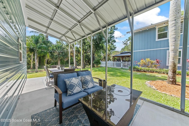 3203 Wind Song Ct, Melbourne, FL 32934 - sunroom / solarium featuring outdoor dining area and vaulted ceiling