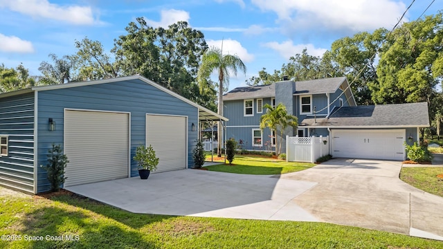 3203 Wind Song Ct, Melbourne, FL 32934 - view of front of home with a garage and a chimney