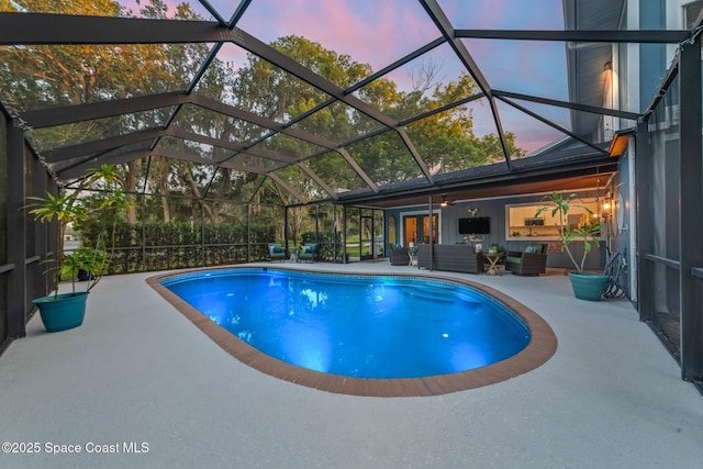 3203 Wind Song Ct, Melbourne, FL 32934 - outdoor pool with a patio area, an outdoor hangout area, french doors, and glass enclosure