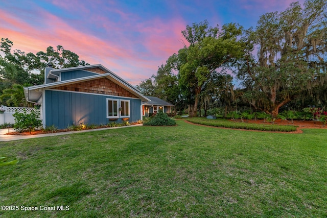 3203 Wind Song Ct, Melbourne, FL 32934 - back of property at dusk featuring board and batten siding