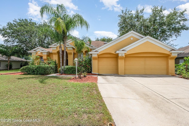 2703 Barrow Dr, Merritt Island, FL 32952 - view of front of house featuring stucco siding, a garage, driveway, and a front yard