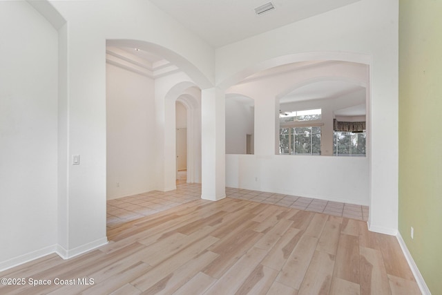 2703 Barrow Dr, Merritt Island, FL 32952 - unfurnished room featuring wood finished floors and arched walkways