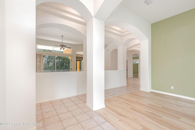 2703 Barrow Dr, Merritt Island, FL 32952 - empty room with ceiling fan, wood finished floors, and arched walkways