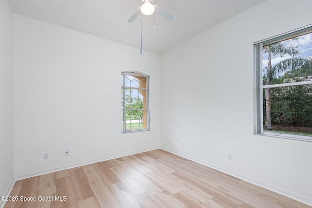 2703 Barrow Dr, Merritt Island, FL 32952 - empty room featuring light wood finished floors, a ceiling fan, and baseboards