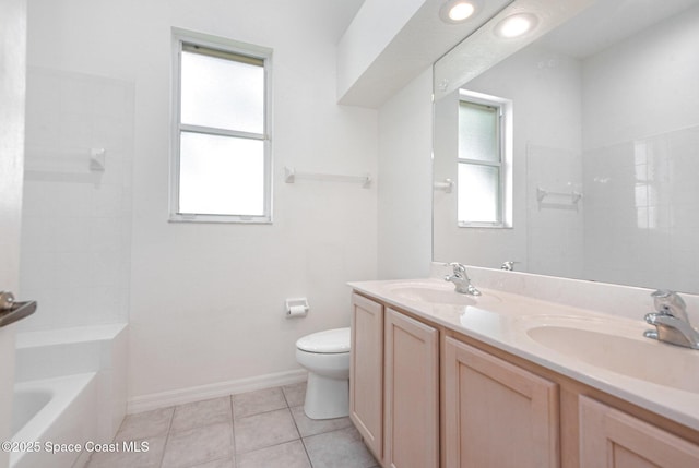 2703 Barrow Dr, Merritt Island, FL 32952 - bathroom with toilet, double vanity, tub / shower combination, tile patterned flooring, and baseboards