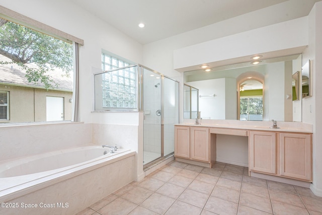 2703 Barrow Dr, Merritt Island, FL 32952 - full bathroom featuring a garden tub, a shower stall, double vanity, tile patterned floors, and recessed lighting