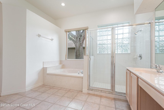 2703 Barrow Dr, Merritt Island, FL 32952 - full bathroom featuring a garden tub, a shower stall, vanity, tile patterned flooring, and recessed lighting