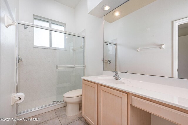 2703 Barrow Dr, Merritt Island, FL 32952 - full bath with toilet, vanity, a shower stall, and tile patterned flooring