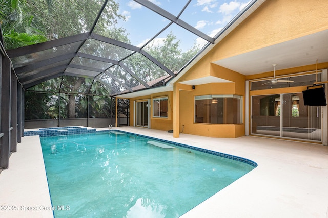 2703 Barrow Dr, Merritt Island, FL 32952 - view of pool with a patio area, ceiling fan, a pool with connected hot tub, and glass enclosure