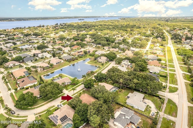 2703 Barrow Dr, Merritt Island, FL 32952 - aerial view of property's location featuring nearby suburban area and a large body of water