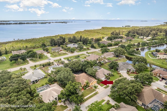 2703 Barrow Dr, Merritt Island, FL 32952 - aerial view of residential area with a nearby body of water