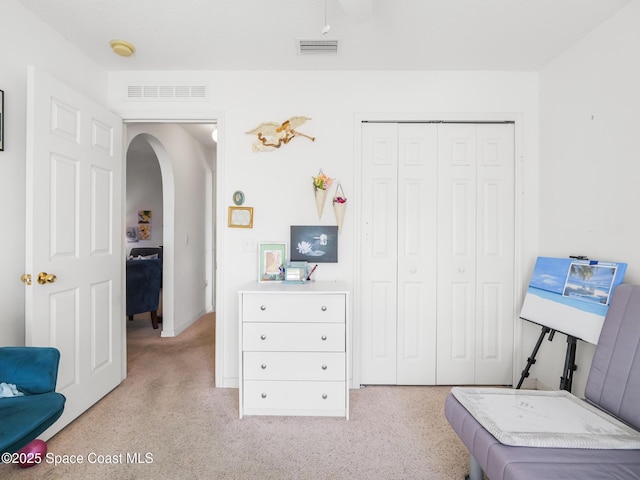 1406 Mycroft Dr, Cocoa, FL 32926 - living area featuring arched walkways, light carpet, and baseboards