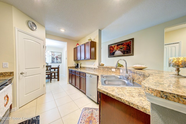 469 Aviation Ave NE, Palm Bay, FL 32907 - kitchen featuring stainless steel dishwasher, a sink, light tile patterned floors, light countertops, and a textured ceiling