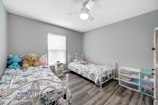 870 Buchanan Ave SE, Palm Bay, FL 32909 - bedroom with wood finished floors, baseboards, and ceiling fan