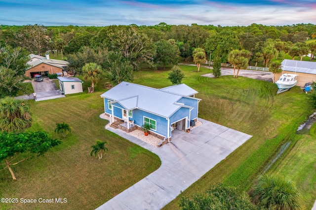 5853 Goldrush Ave, Grant-Valkaria, FL 32949 - view from above of property with a forest