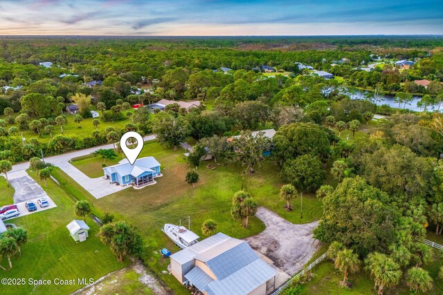 5853 Goldrush Ave, Grant-Valkaria, FL 32949 - aerial view at dusk of a view of trees