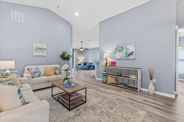 681 Dillard Dr SE, Palm Bay, FL 32909 - living area with wood finished floors, baseboards, a ceiling fan, lofted ceiling, and recessed lighting